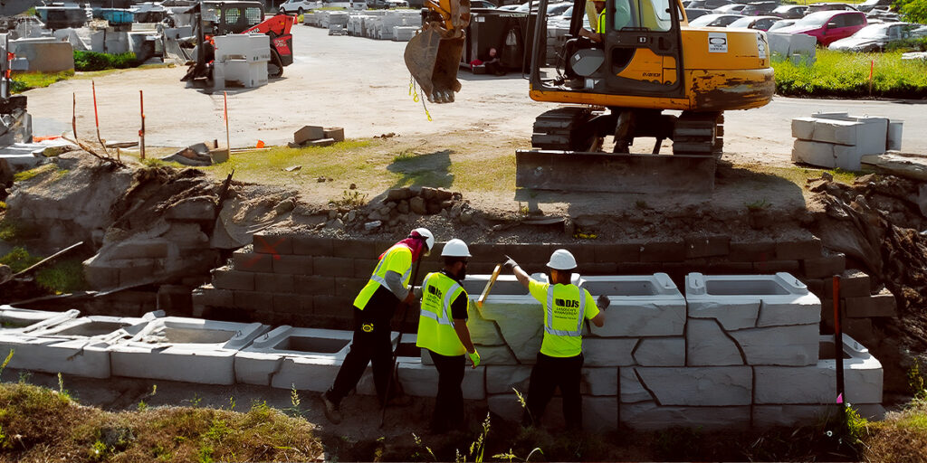 DJ's employees working on a commercial landscape construction project