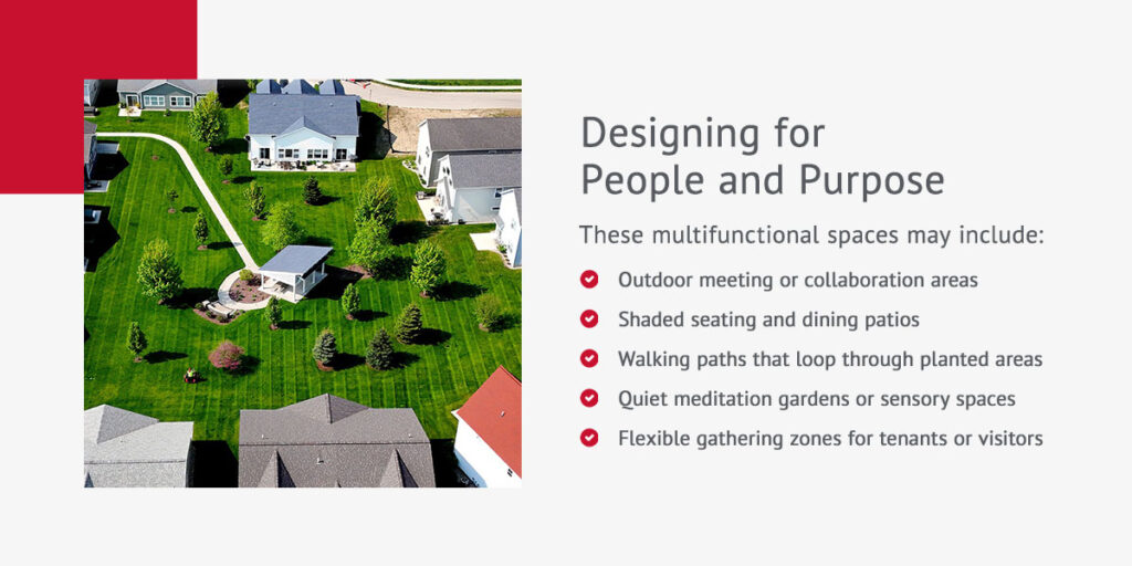 aerial shot of a residential community's outdoor common area with landscaping, trees, benches and a pavilion